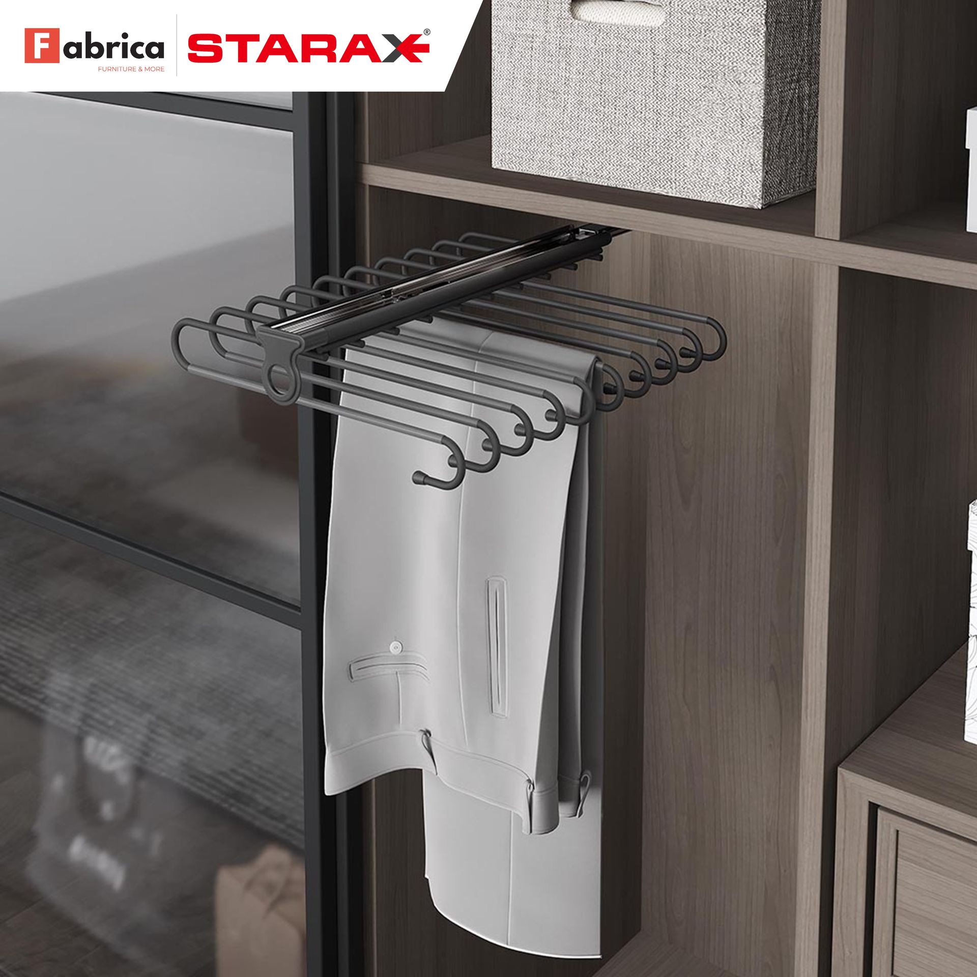 A pair of pants is hanging on a rack in a closet.