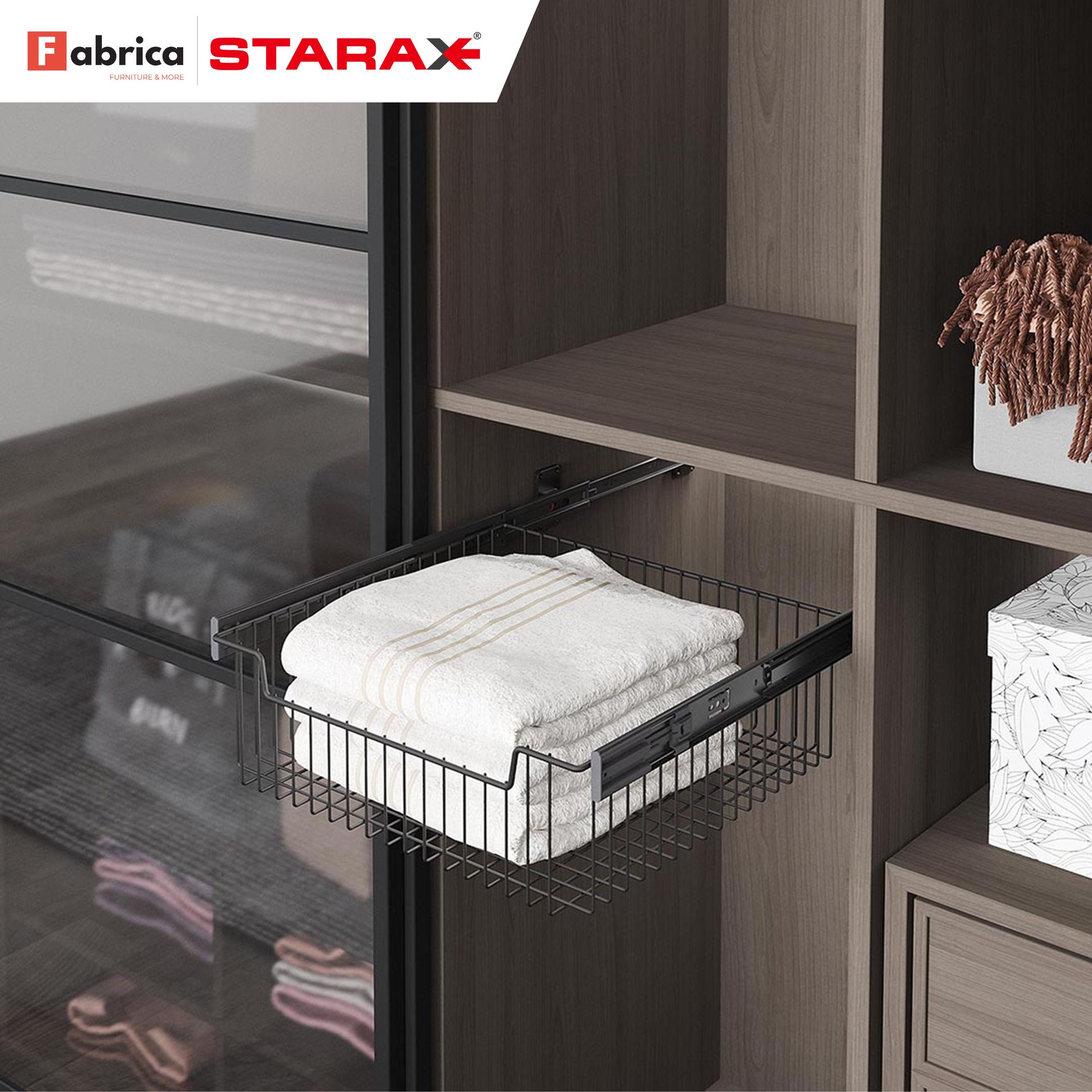 A stack of towels is in a wire basket in a closet.