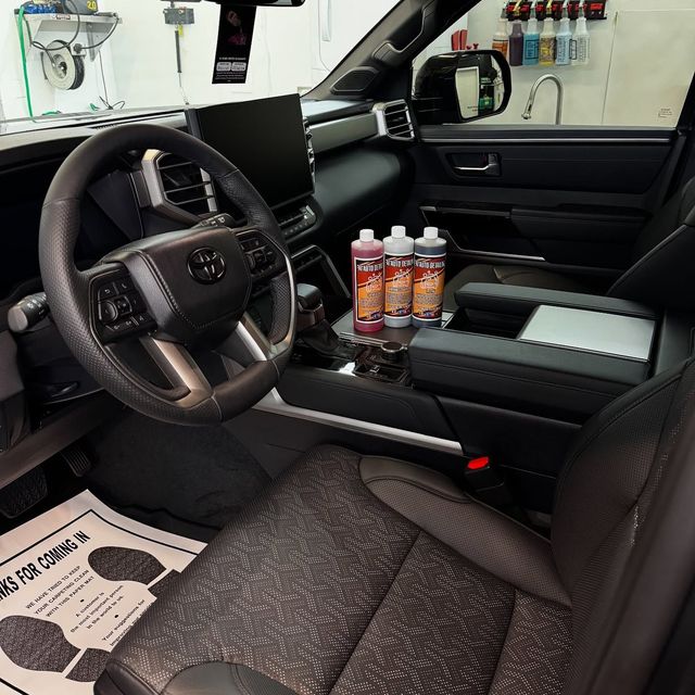 Interior scrub-down — dash, console and door panels hand-cleaned