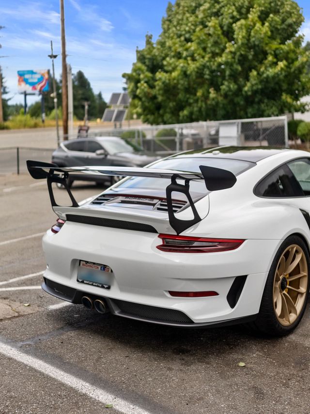 Glossy white sports car after a clay bar and wax