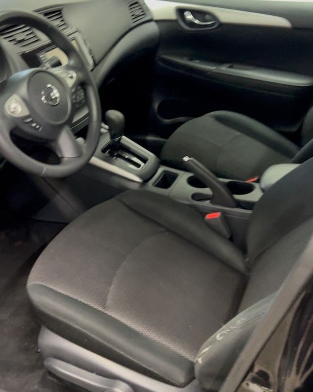 Driver seat after a shampoo interior detail — clean cloth seat
