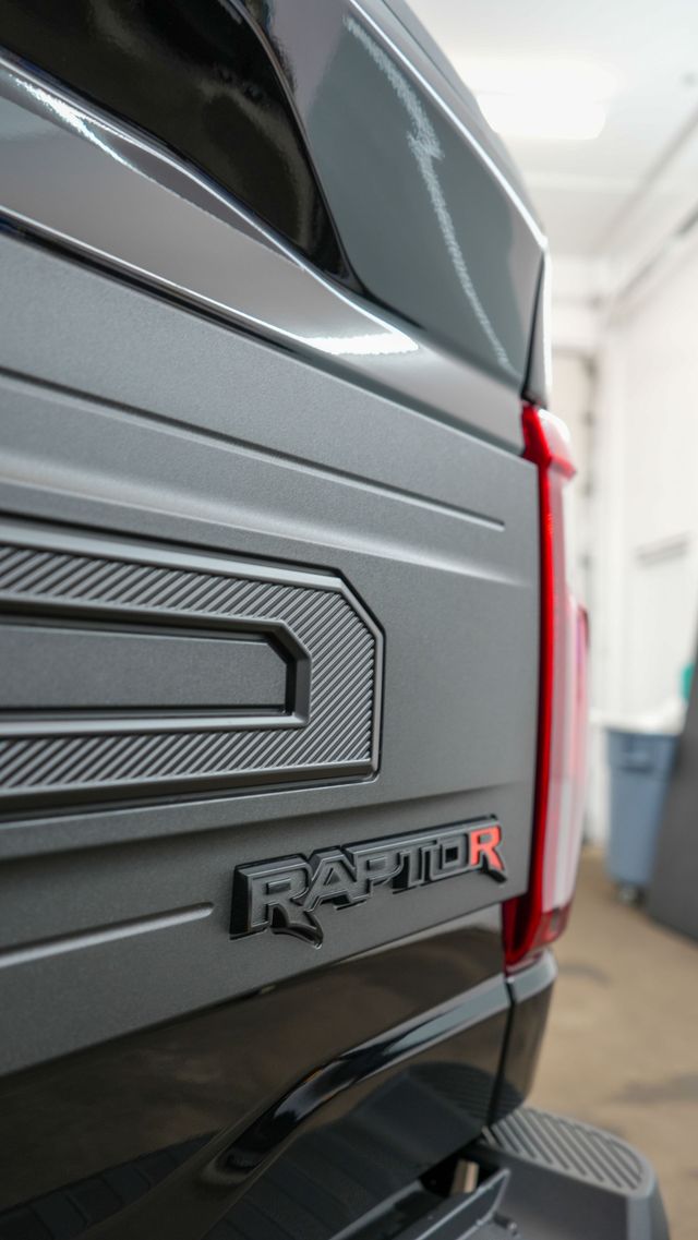 Black Ford truck front end after a full detail