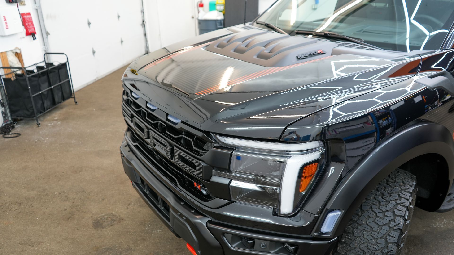 Black Ford truck front end after a full detail