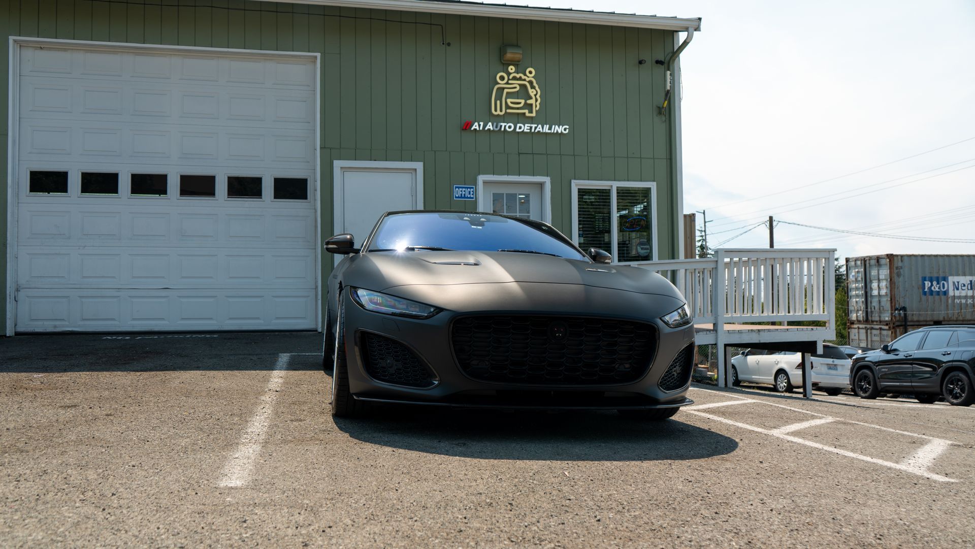 Satin-wrapped Jaguar F-Type parked outside the A1 Auto Detailing shop in Lynnwood, WA