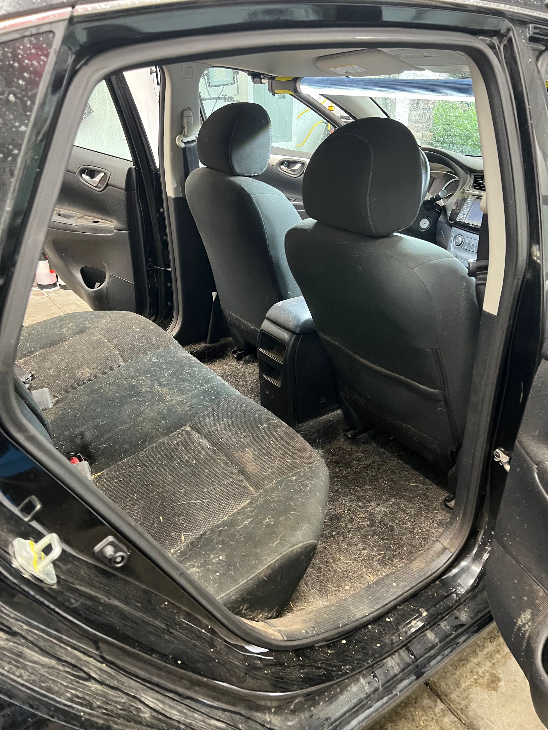 Before: smoke residue, ash and grime across the seats and carpet of a customer vehicle