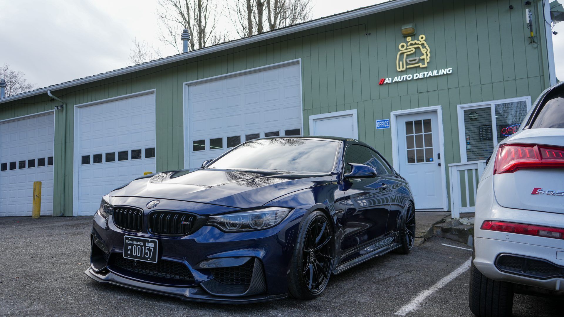 Tinted BMW M4 parked outside the A1 Auto Detailing shop in Lynnwood, WA