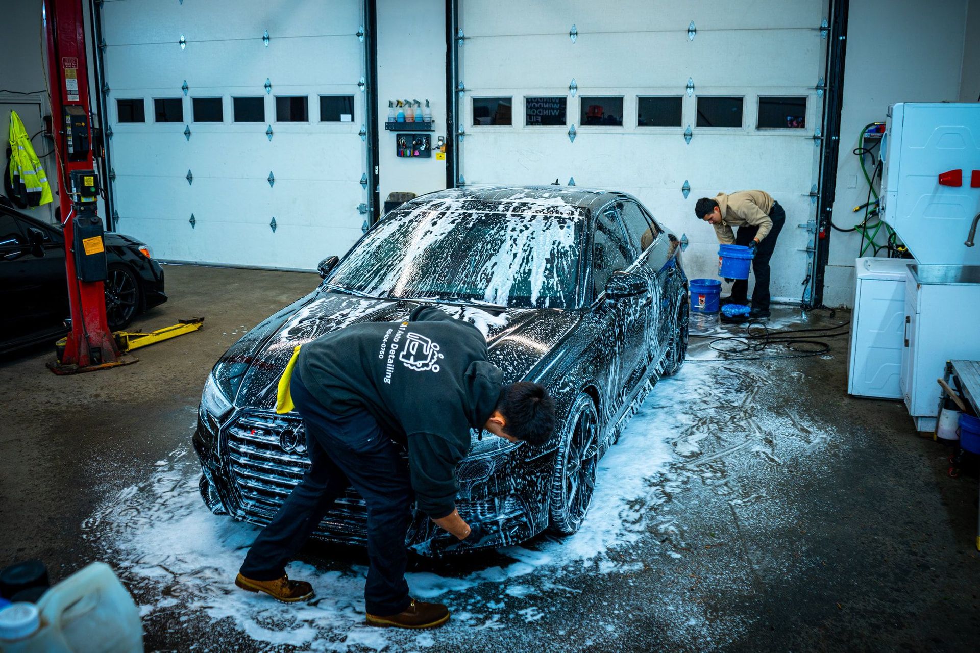 A1 Auto Detailing technician machine polishing a vehicle during paint correction in Lynnwood, WA