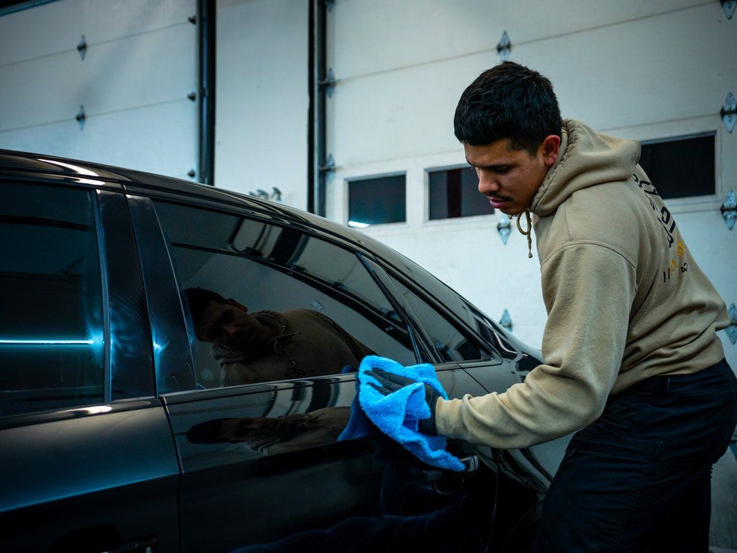 A1 Auto Detailing technician machine polishing a vehicle during paint correction in Lynnwood, WA