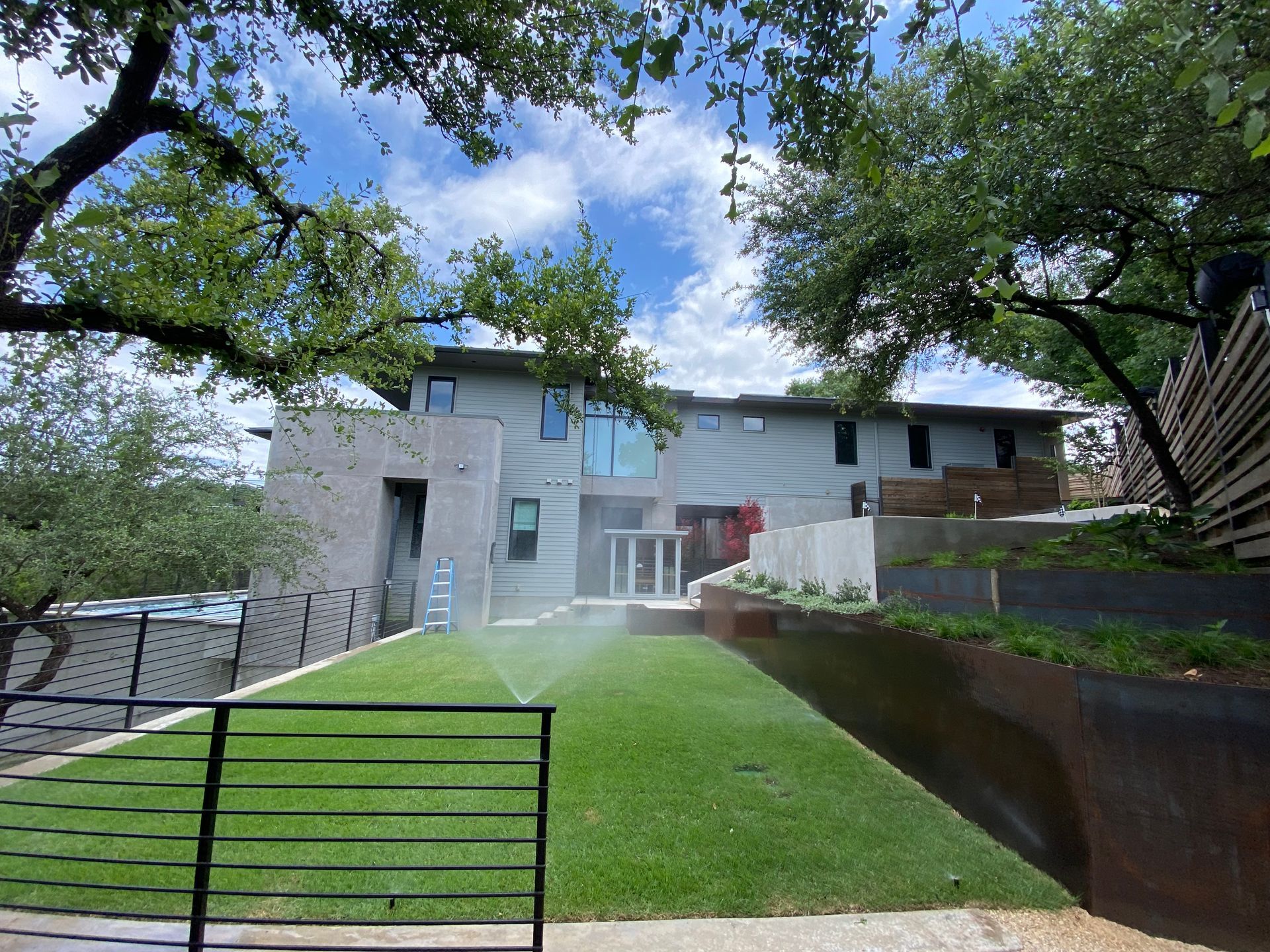 A large house with a large lawn in front of it