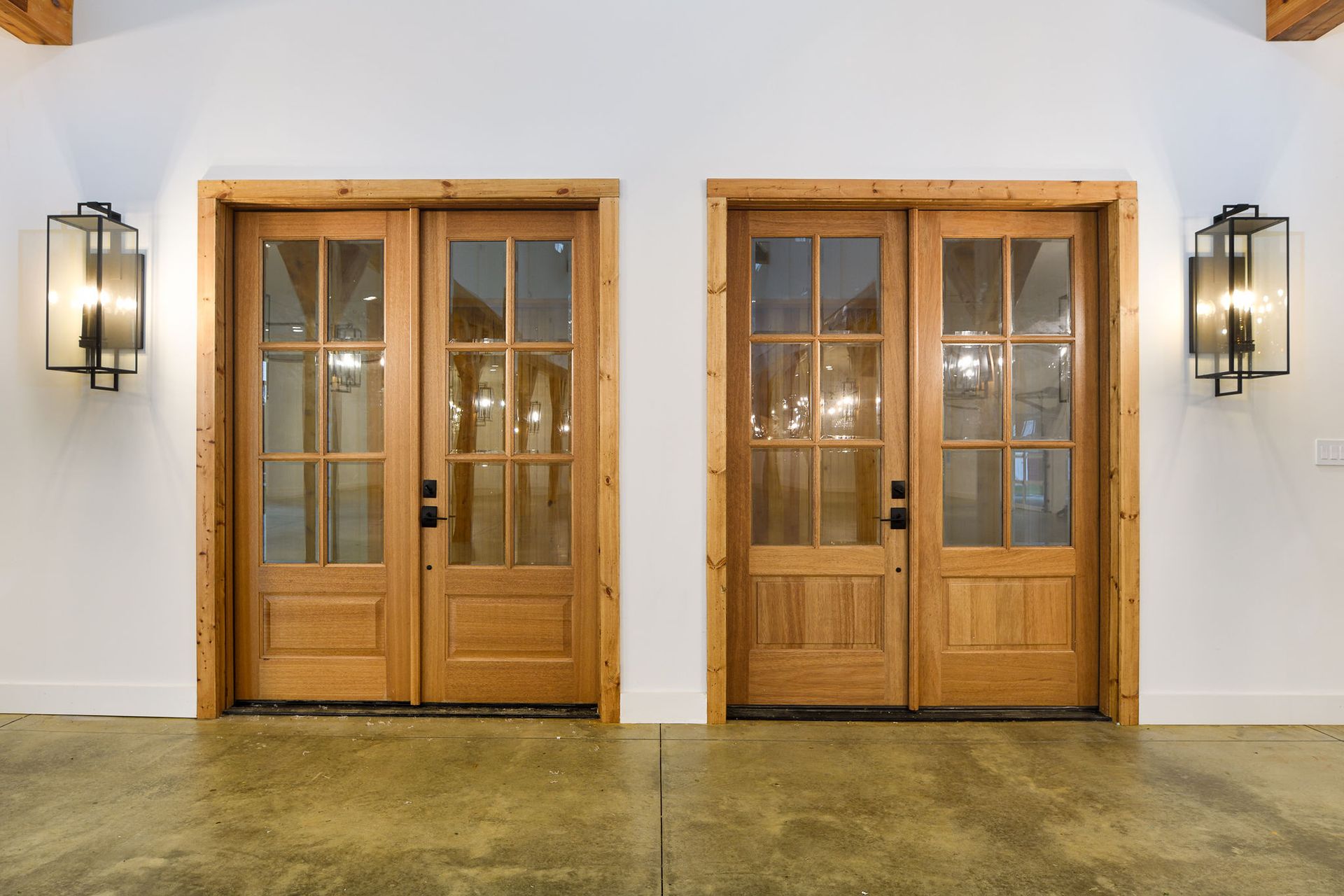 wooden doors with large windows into kernersville family farm