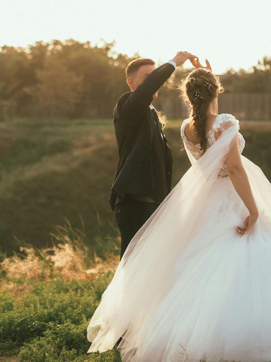 groom twirling bride