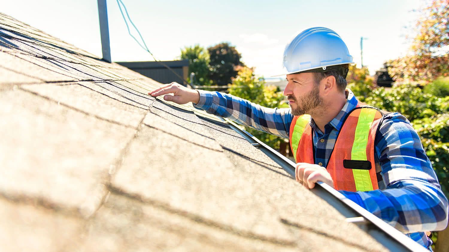 Roof inspector inspecting a roof