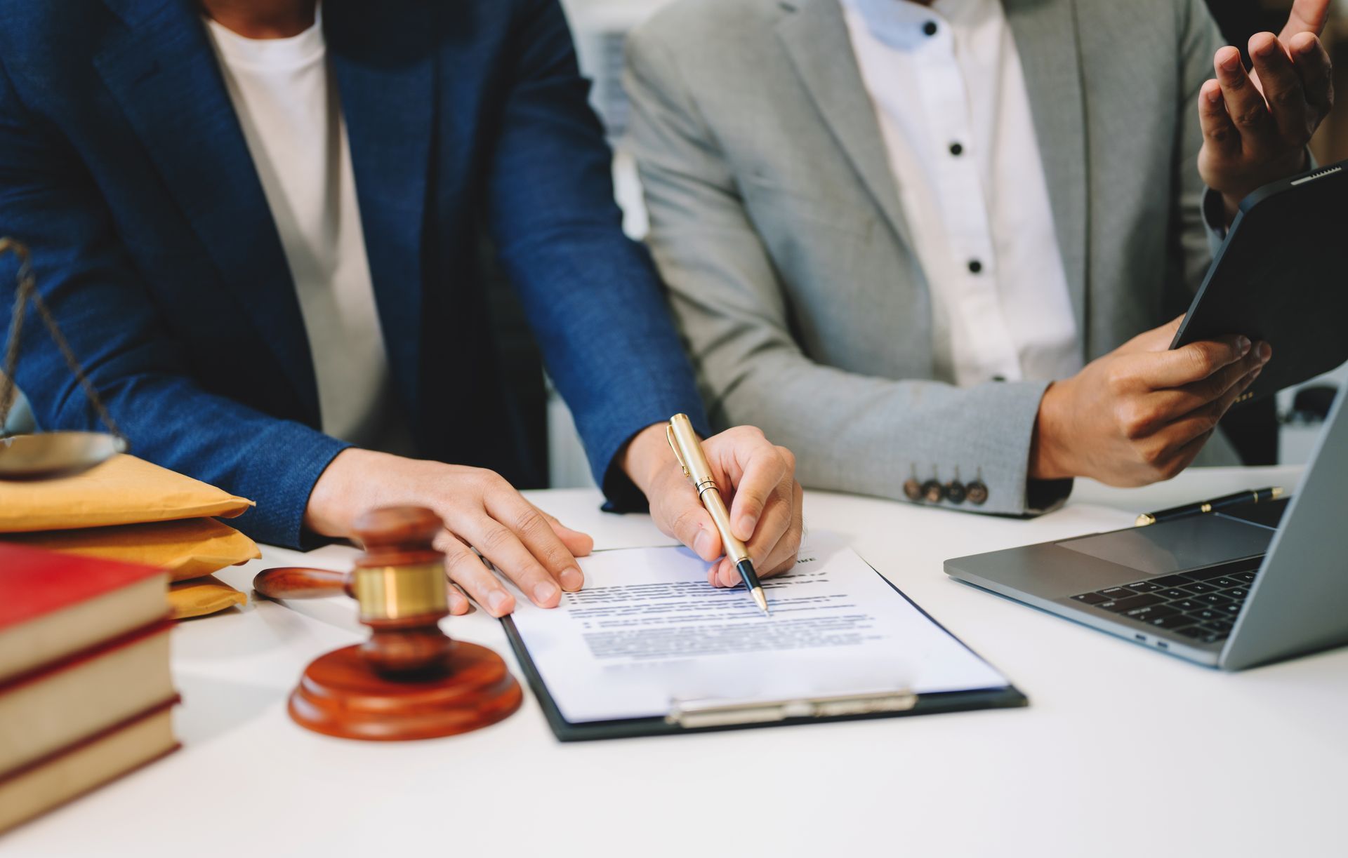 two person signing documents 