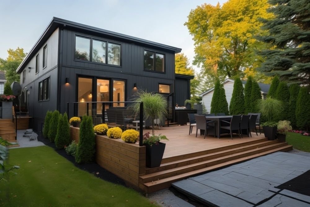 wood deck with landscaping in backyard of home