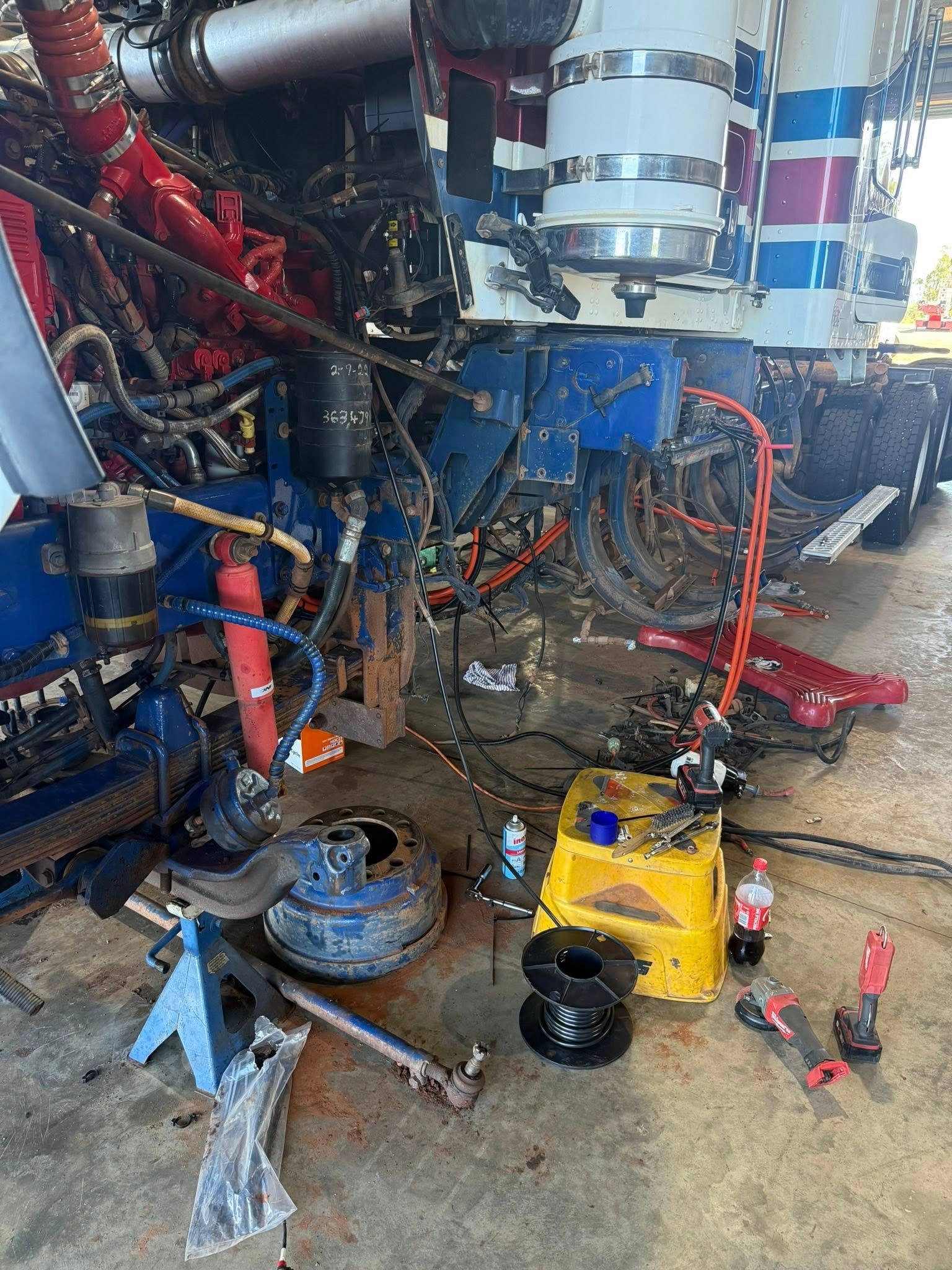 A Dismantled Semi-truck Engine Bay Under Repair — Full Torque Transport In Parkhurst, QLD