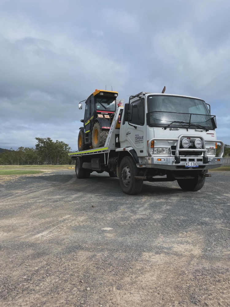 A Yellow Forklift On The Truck — Full Torque Transport In Parkhurst, QLD