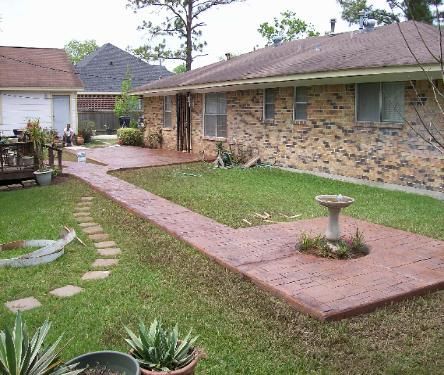 A brick house with a walkway leading to it