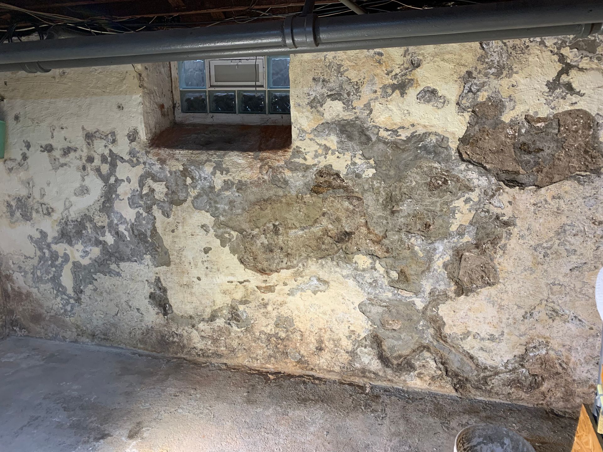 Basement Stucco Parging Before