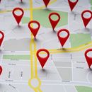 Red map pins marking multiple locations on a street map with highlighted yellow routes.