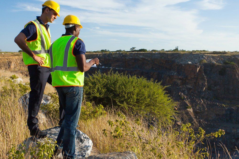 Two Male Surveyors Checking Site — Business Support Services Near Bowen, QLD