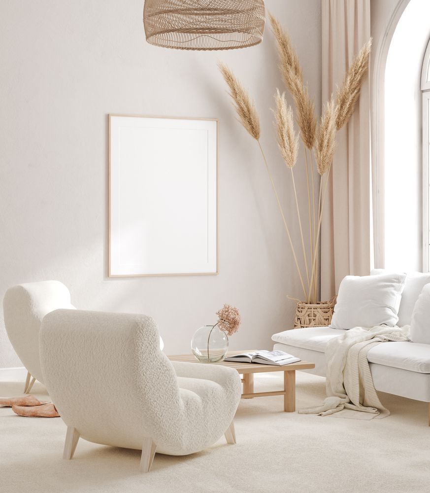 White Chairs, Couch, Wooden Table, Dried Plants, and Woven Light Fixture — Proshield Insulation & Waterproofing In Shellharbour, NSW