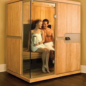 Relaxing infrared sauna with warm wooden interior and glowing light, ideal for detoxification and st