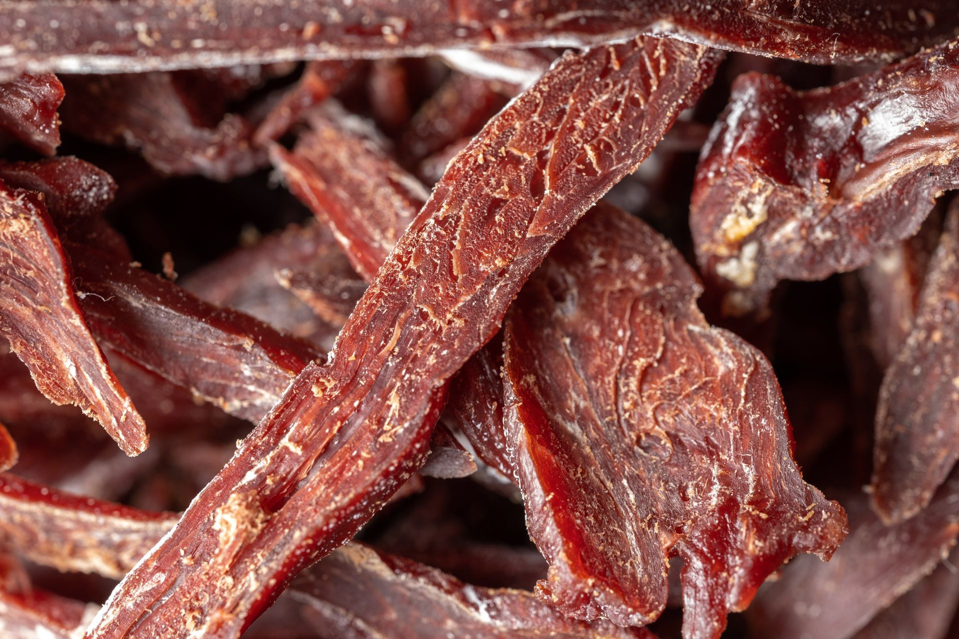 Dried beef jerky strips close-up showing preserved texture and lean protein
