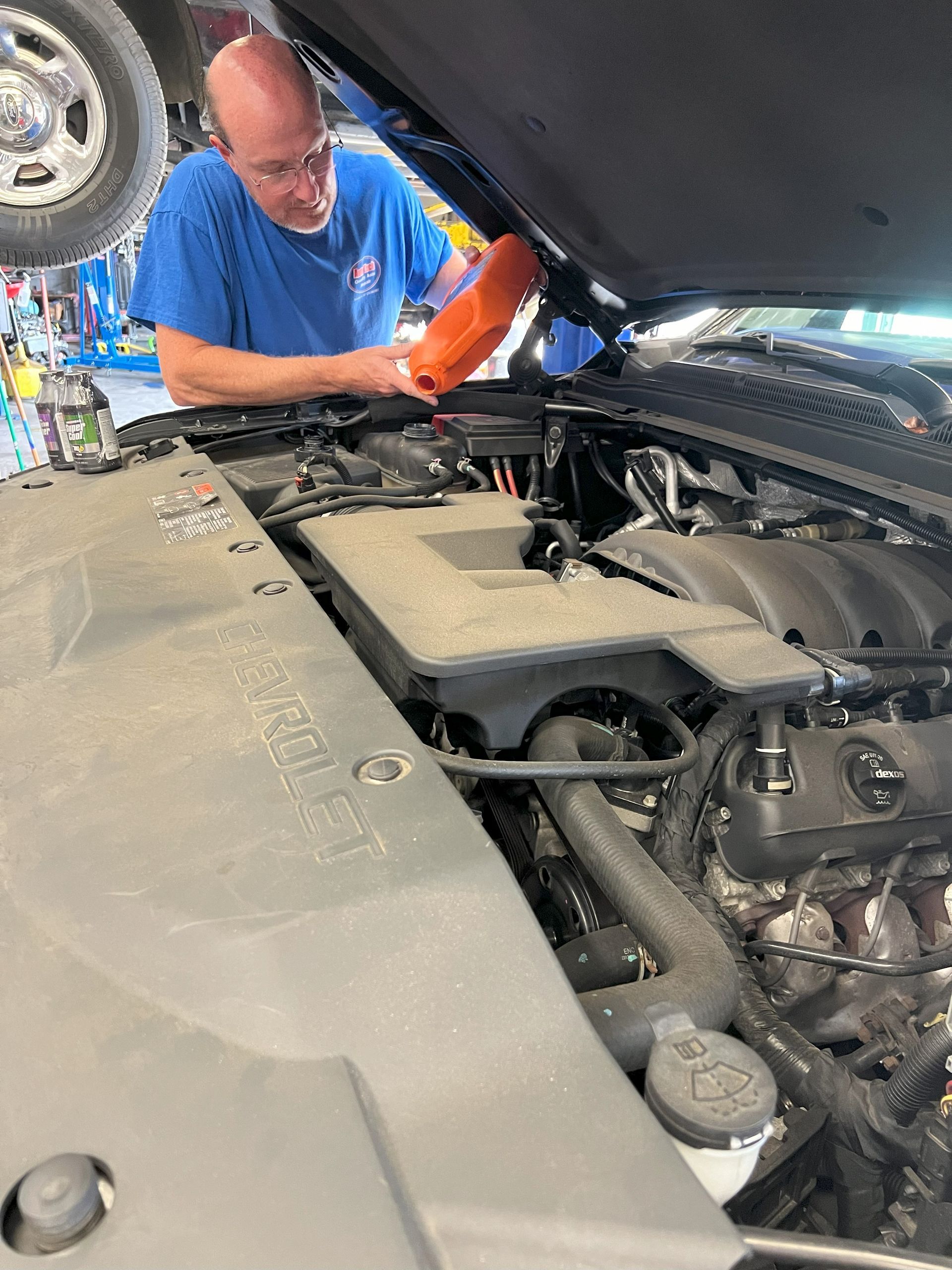 mechanic adding coolant auto tech Martinsville, Va 24112