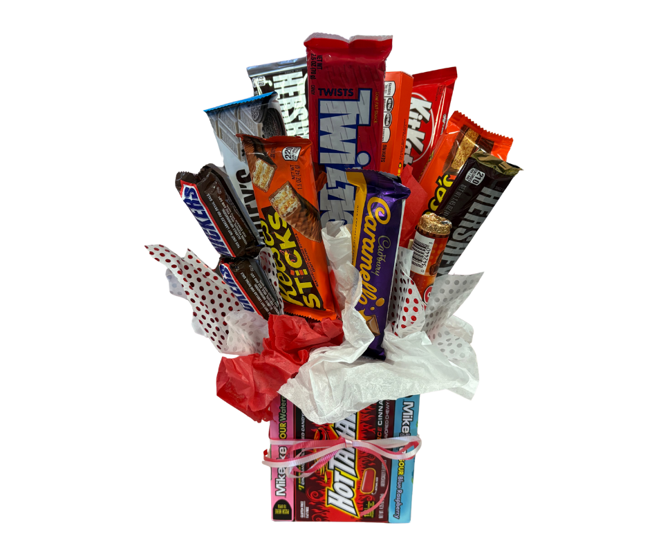 A bouquet made of various chocolate bars and candy, wrapped with decorative tissue paper and tied with a pink ribbon.