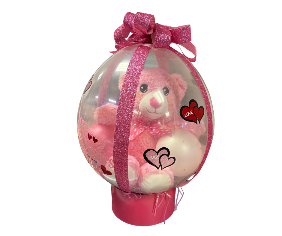 A Stitch plush toy sits inside a clear, spherical balloon filled with small purple balloons, marked 