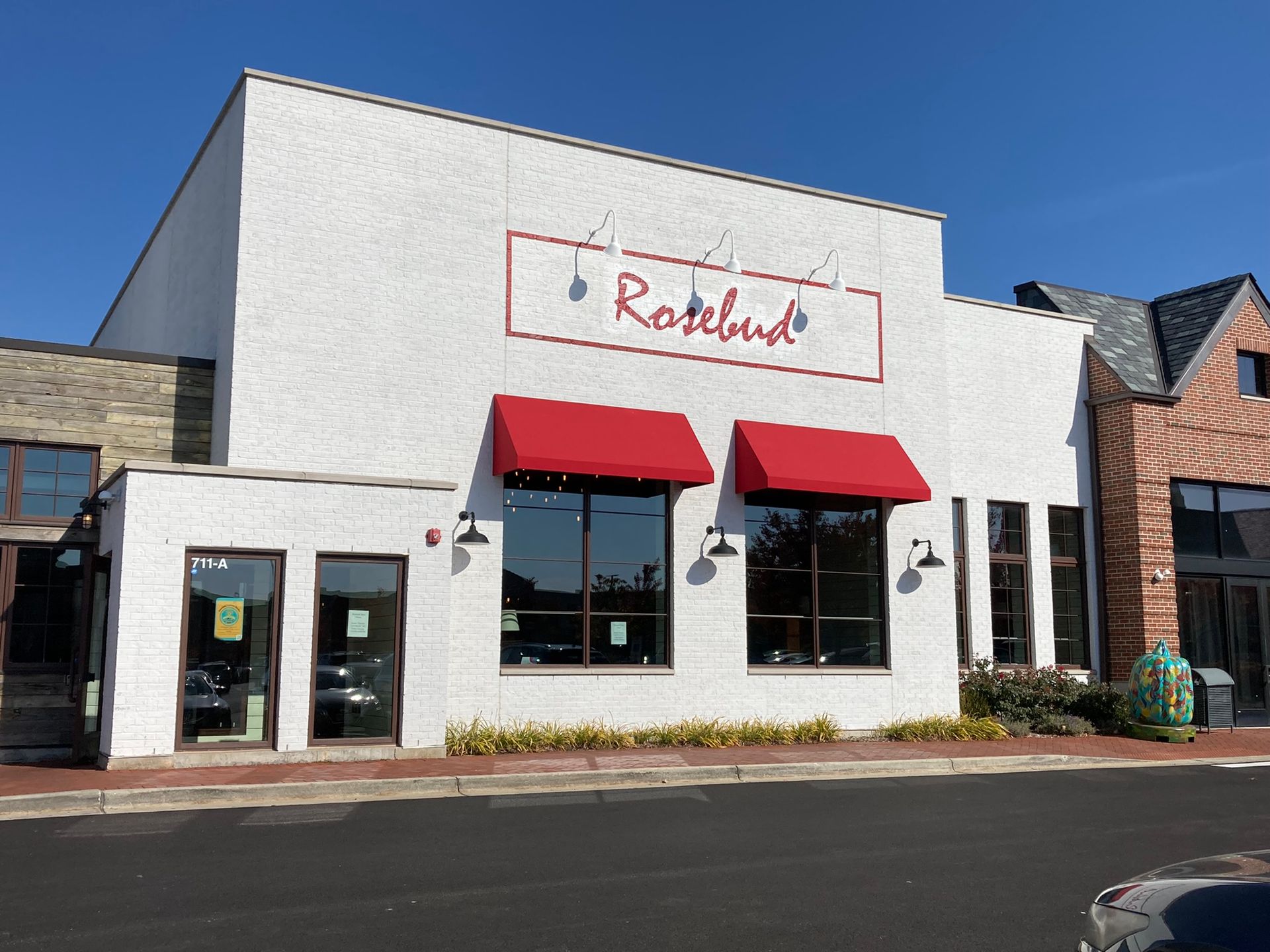 White building with red awnings, 