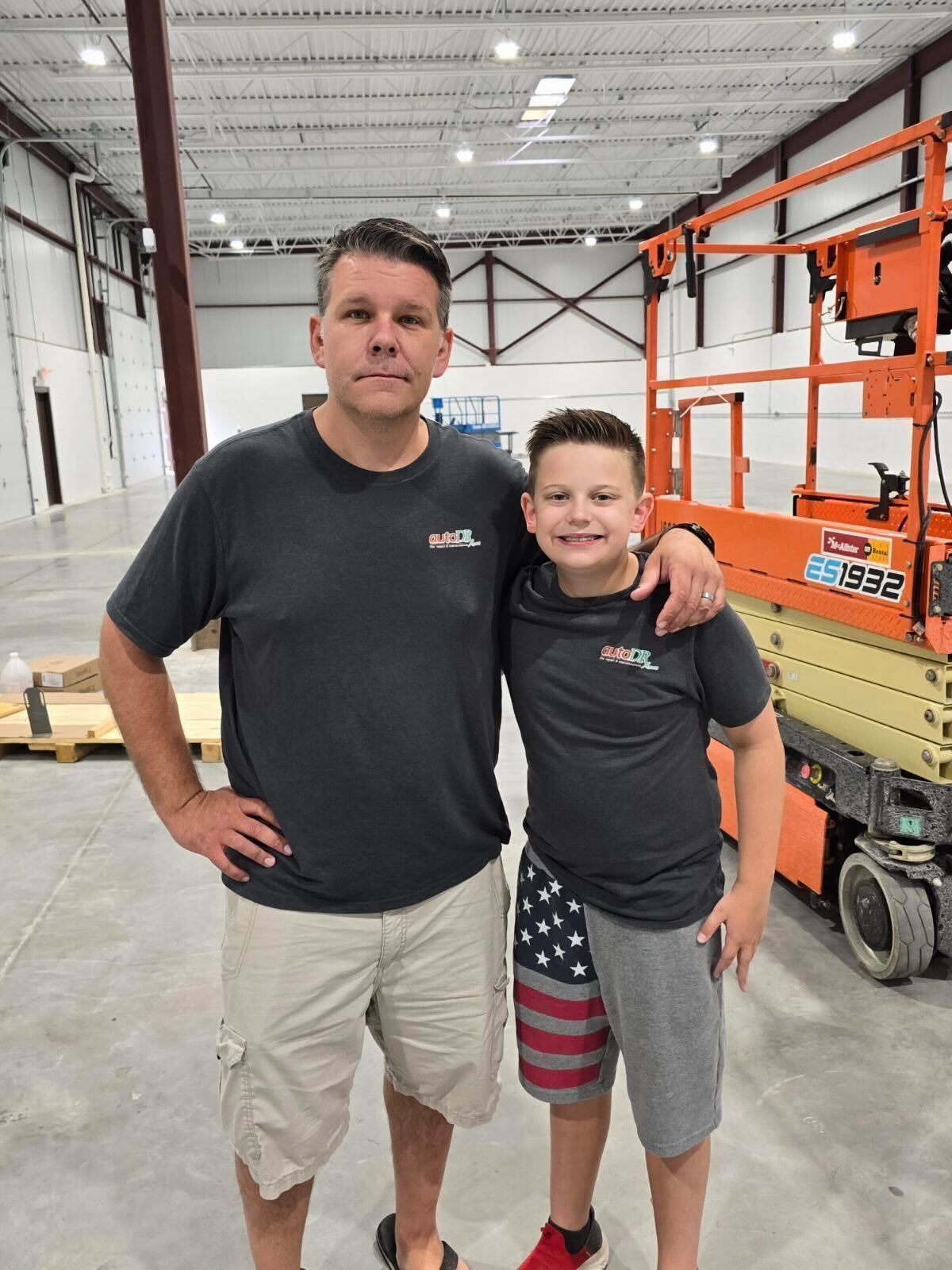 Auto Repair Shop Owners Standing Inside New Facility | Auto DR
