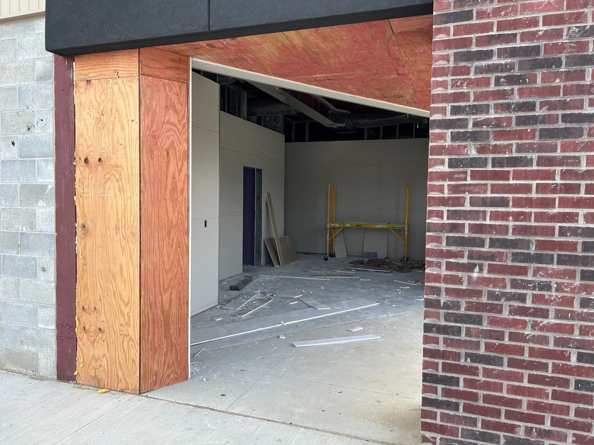Auto Repair Service Bay Entrance With Brick And Wood Framing | Auto DR