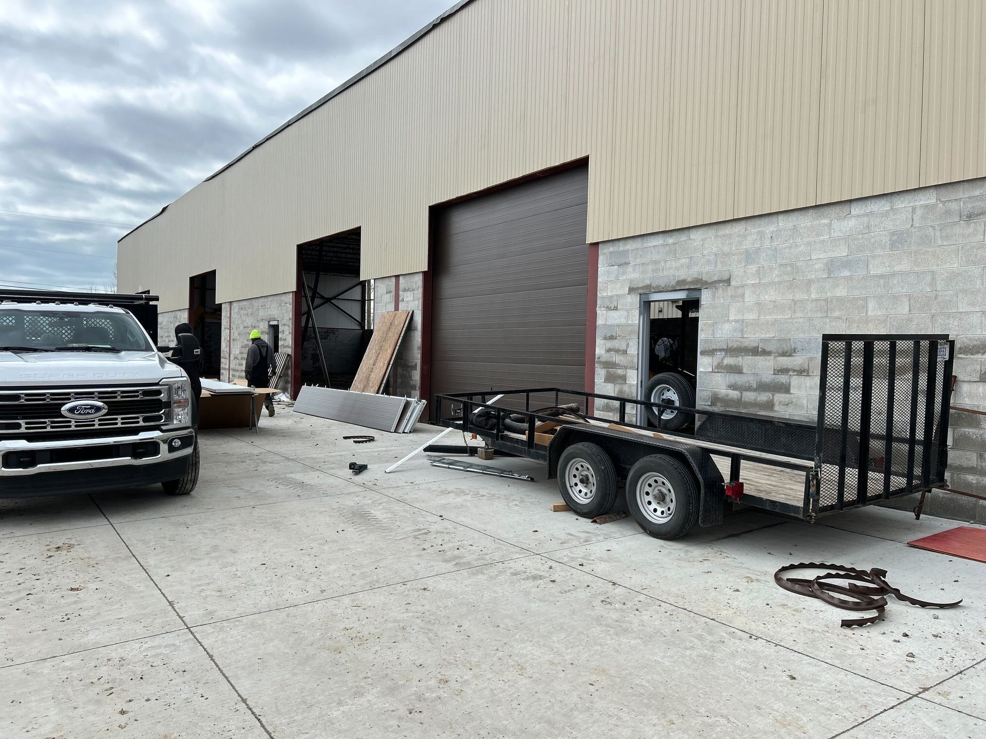 Service Vehicles Parked Outside Auto Repair Shop During Setup | Auto DR