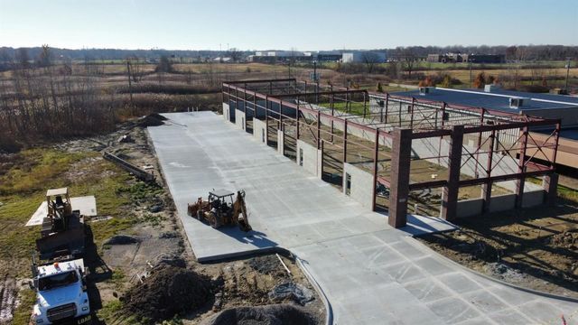 Wide Aerial View Of Auto Repair Building And Driveway | Auto DR