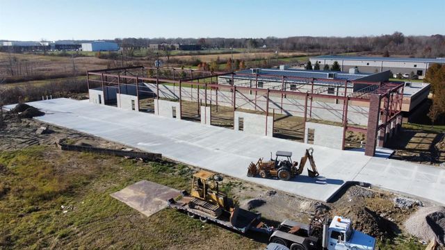 Drone Shot Of Auto Repair Facility With Steel Structure Installed | Auto DR
