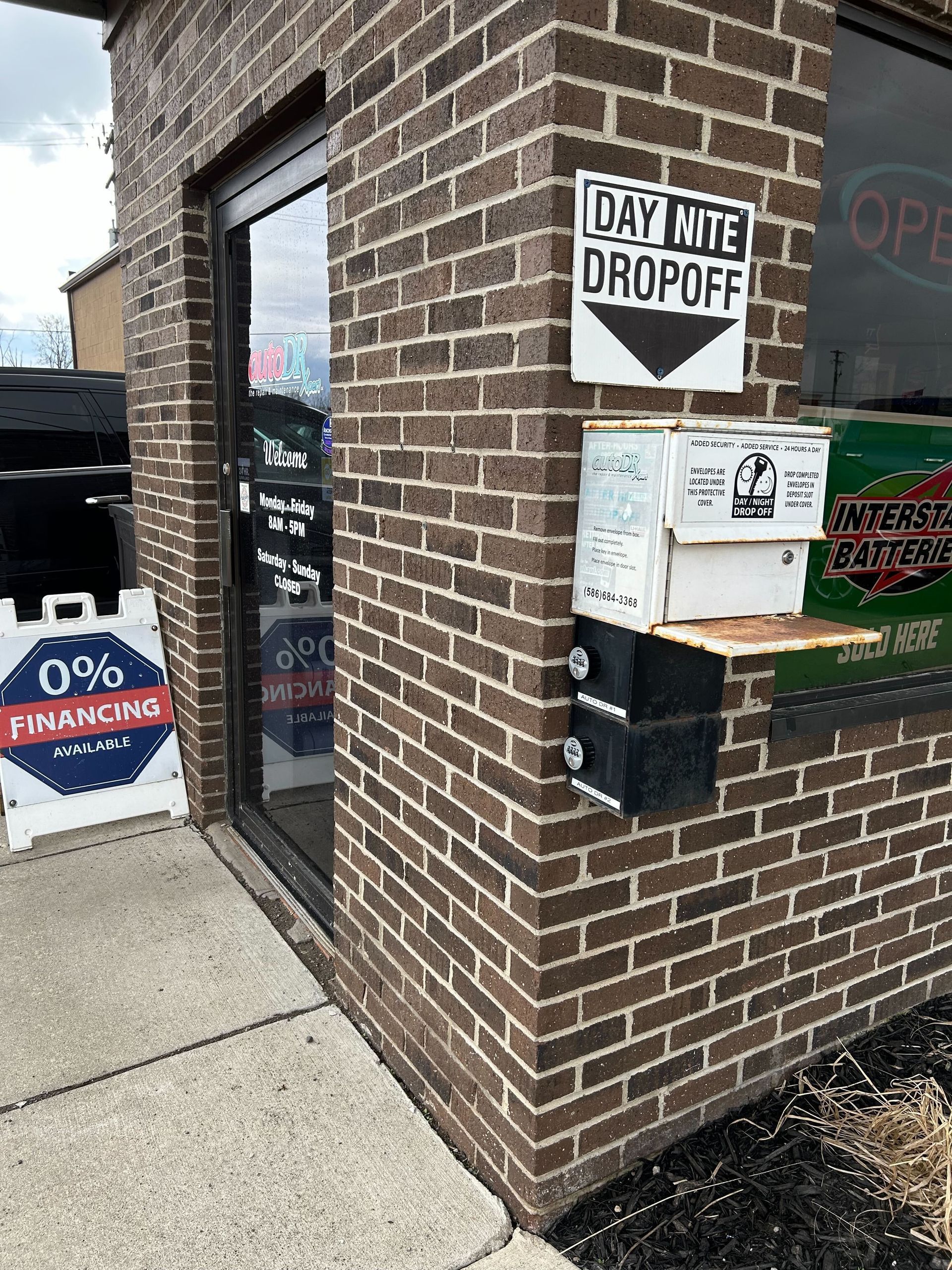 Auto Repair Shop Entrance With Hours And Business Signage | Auto DR