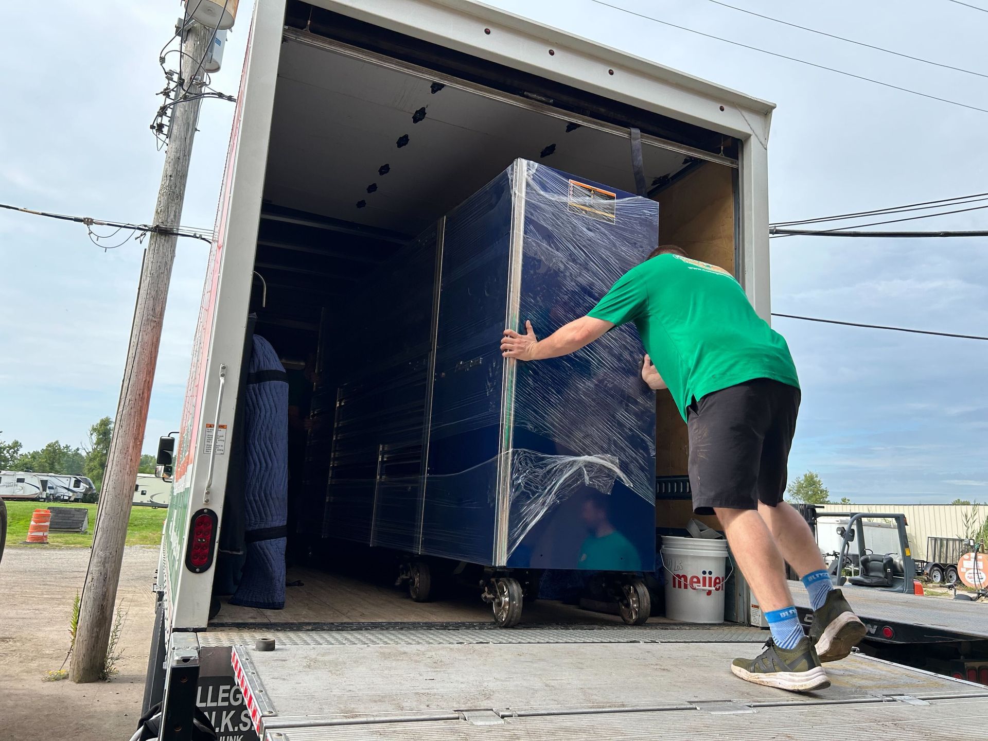 Technician Unloading Equipment From Service Truck | Auto DR