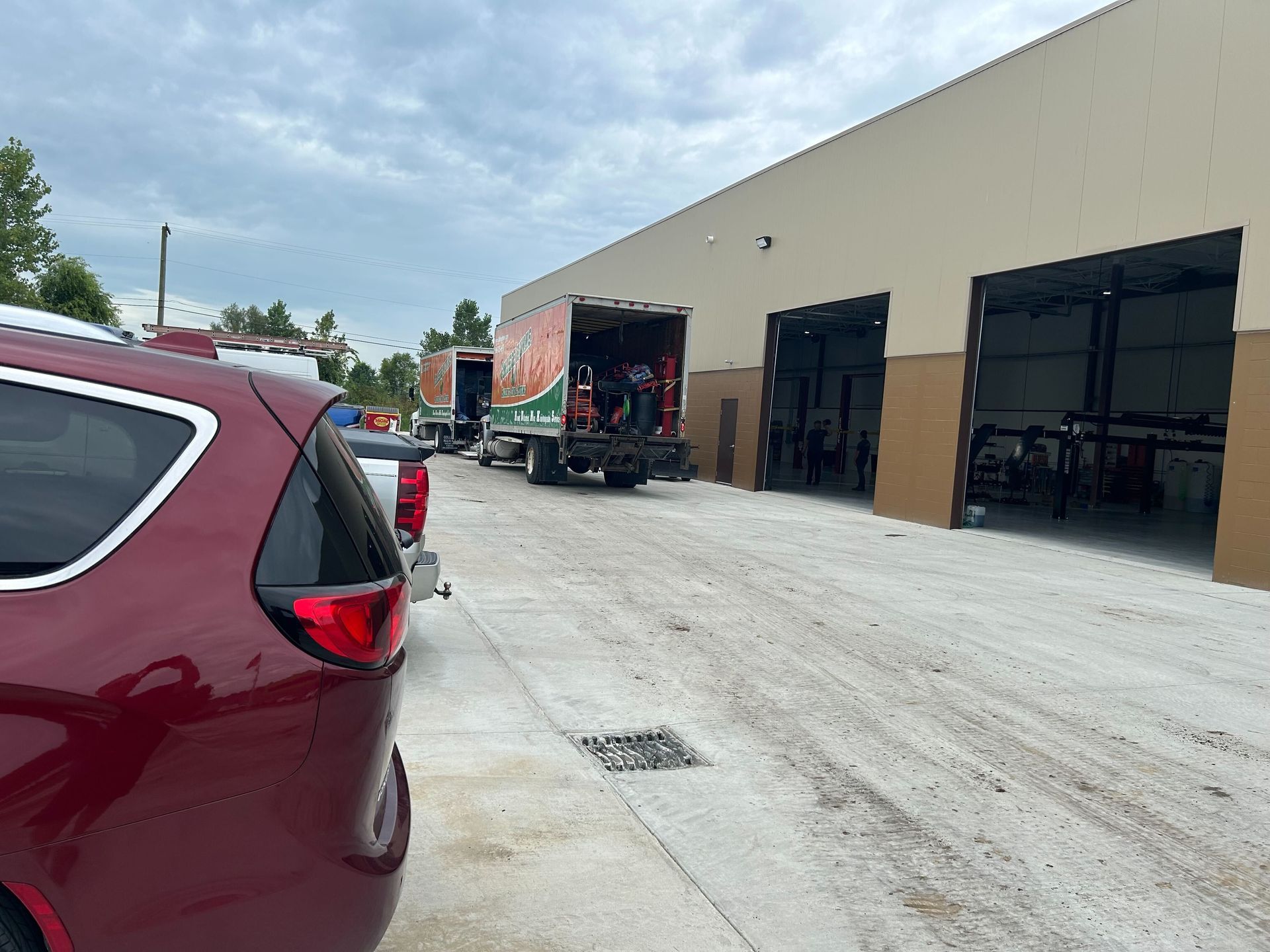 Auto Repair Shop Exterior Driveway And Service Bay Access | Auto DR