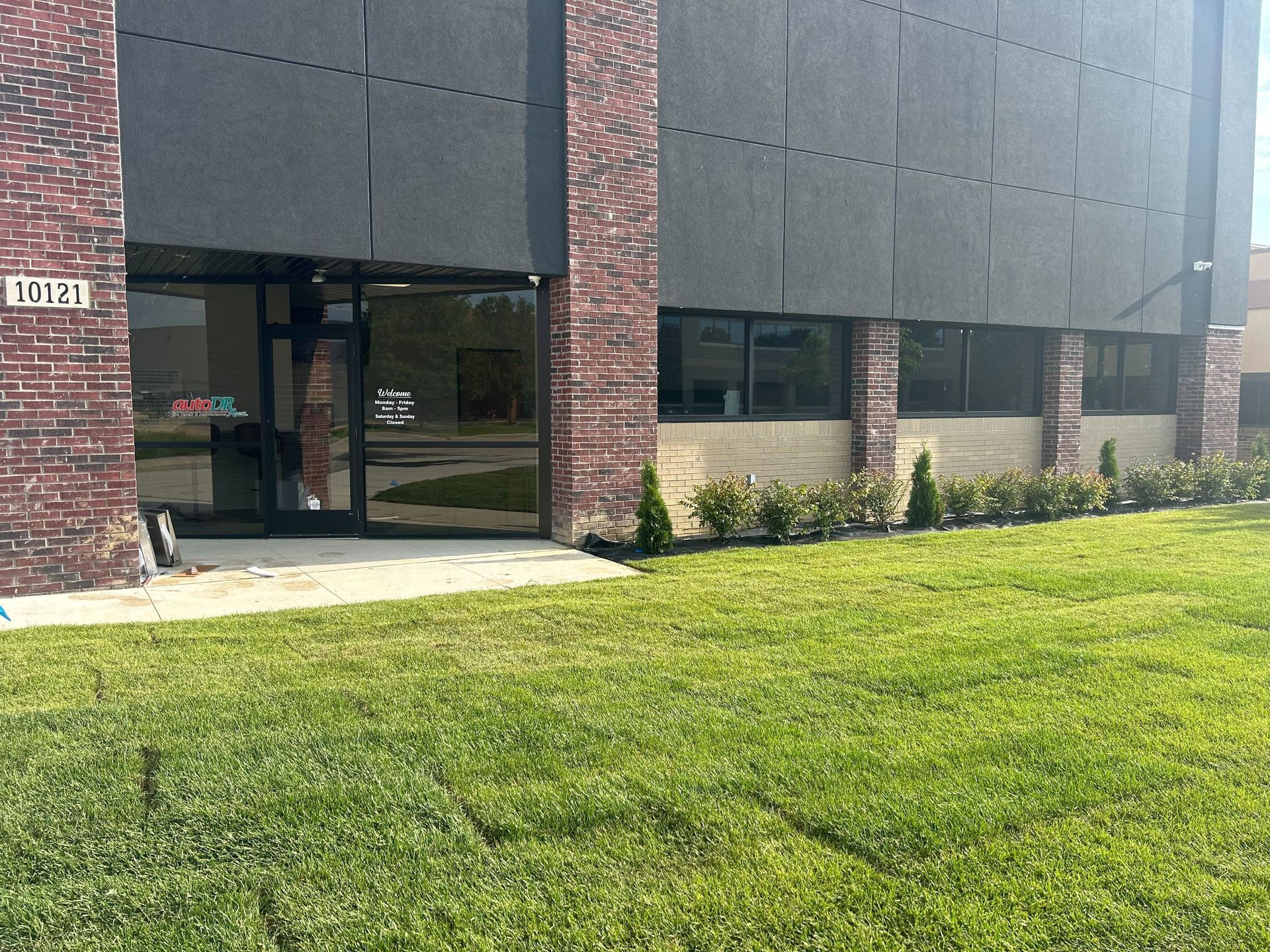 New Auto Repair Facility Exterior With Modern Brick Building | Auto DR