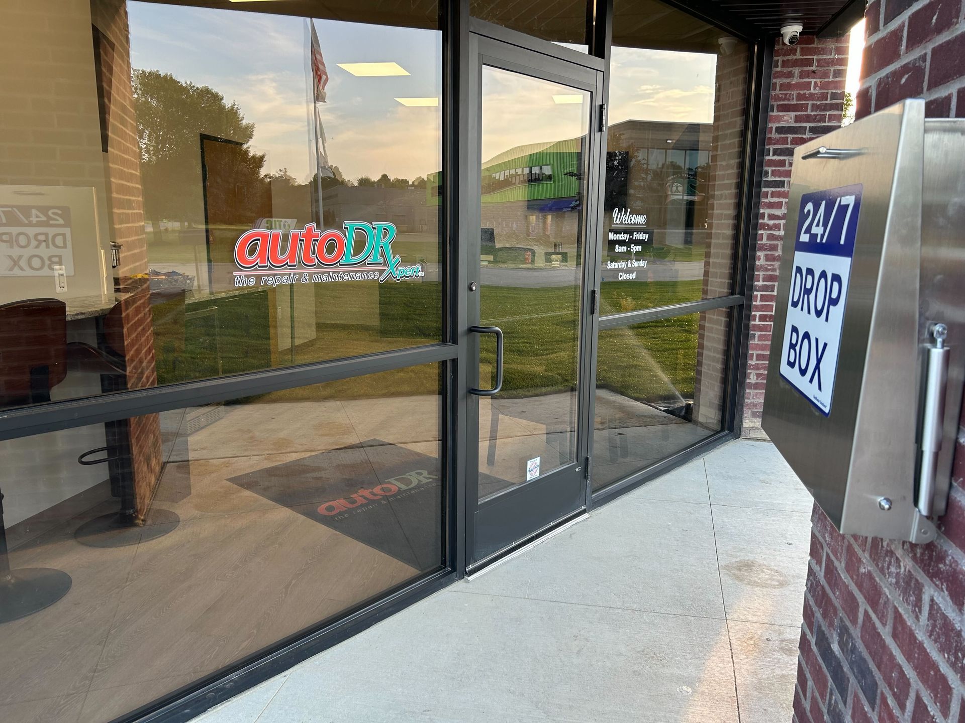 Auto Repair Shop Glass Entrance Door With Auto DR Branding | Auto DR