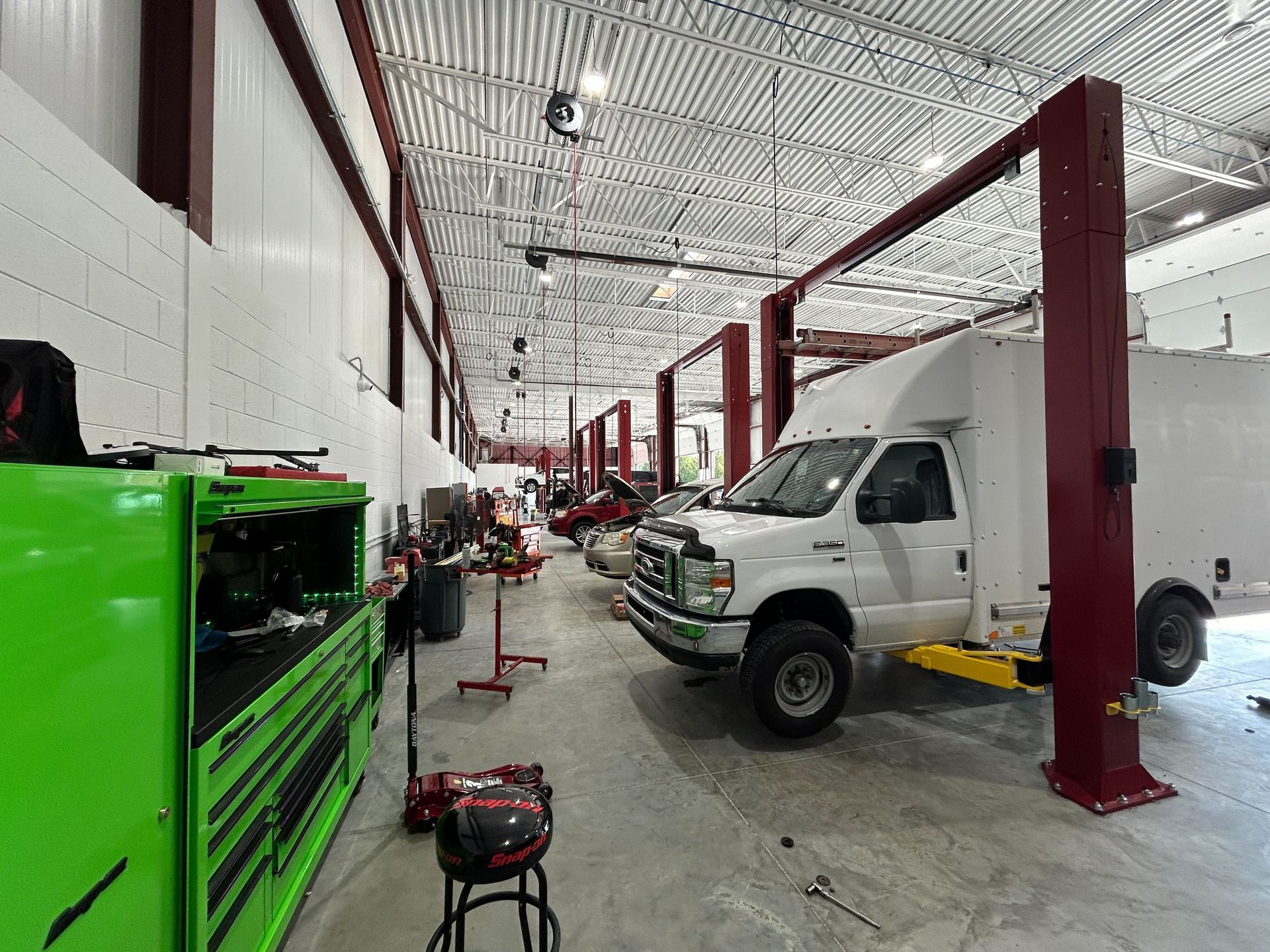 Auto Repair Shop Interior With Vehicles On Lifts | Auto DR