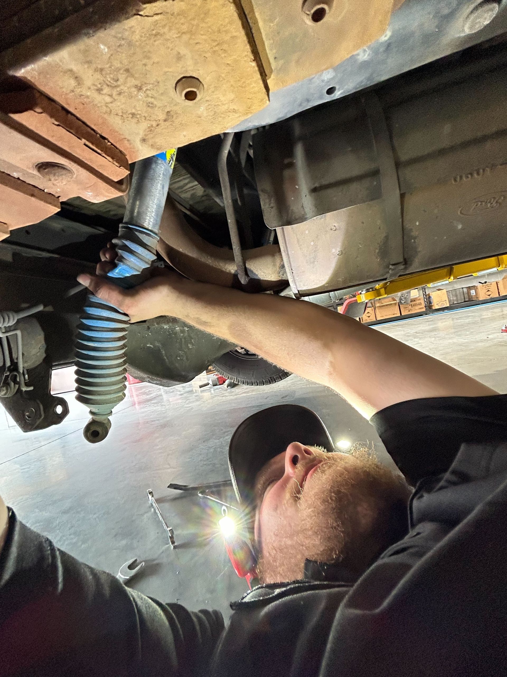 Automotive Technician Inspecting Undercarriage Components | Auto DR