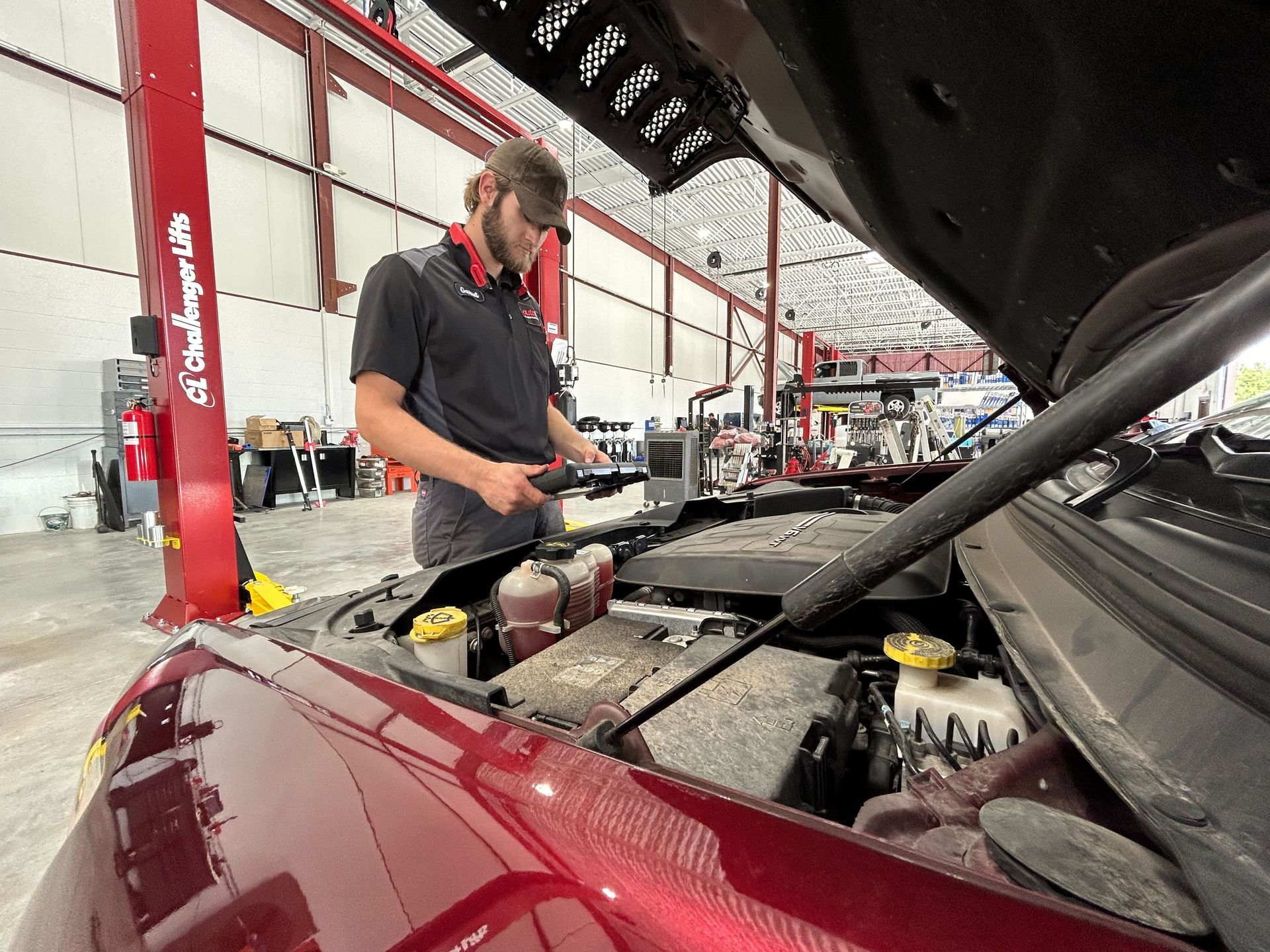 Mechanic Performing Engine Repair With Hood Open | Auto DR