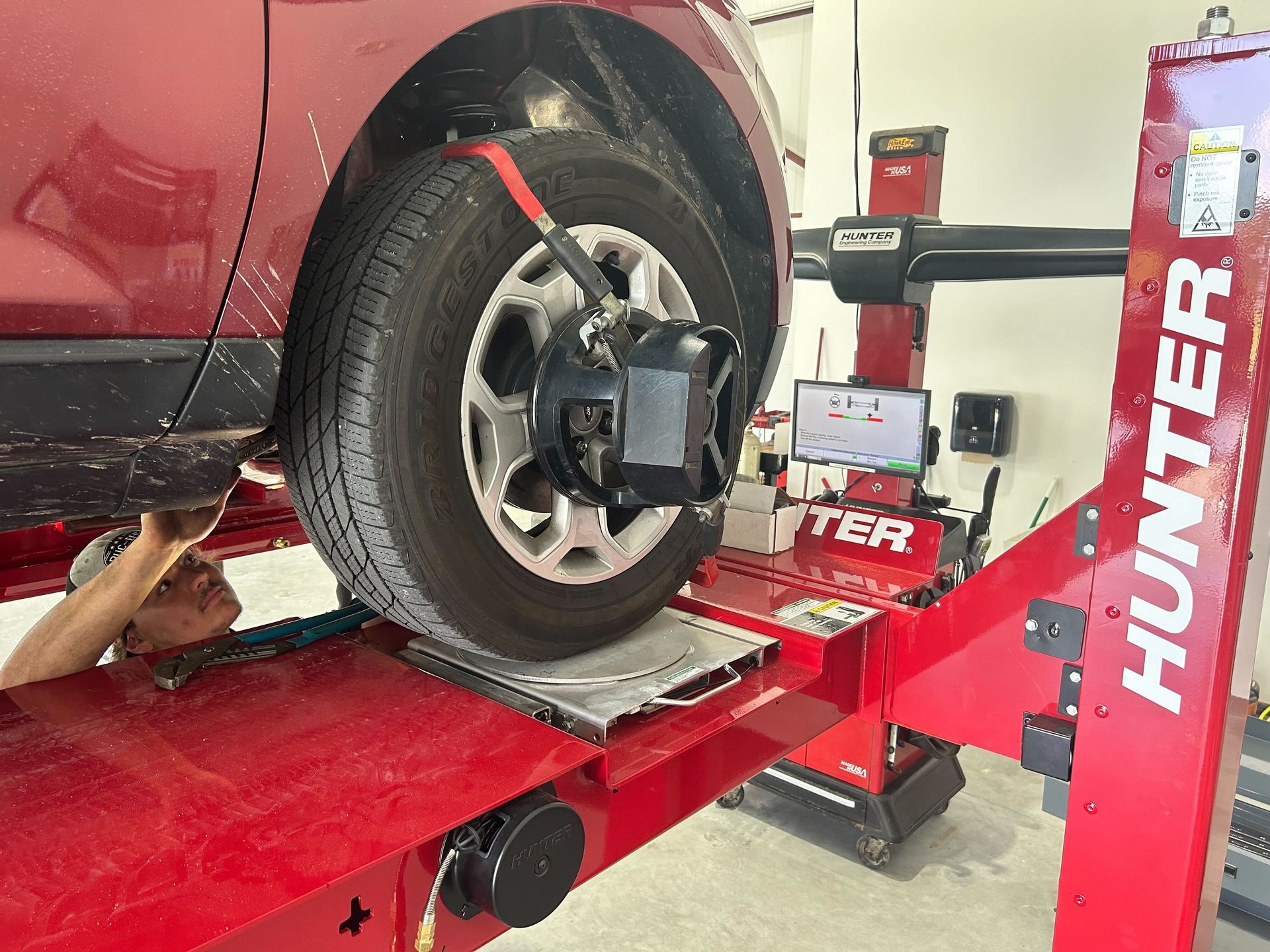 Automotive Alignment Service Performed On Vehicle Lift | Auto DR