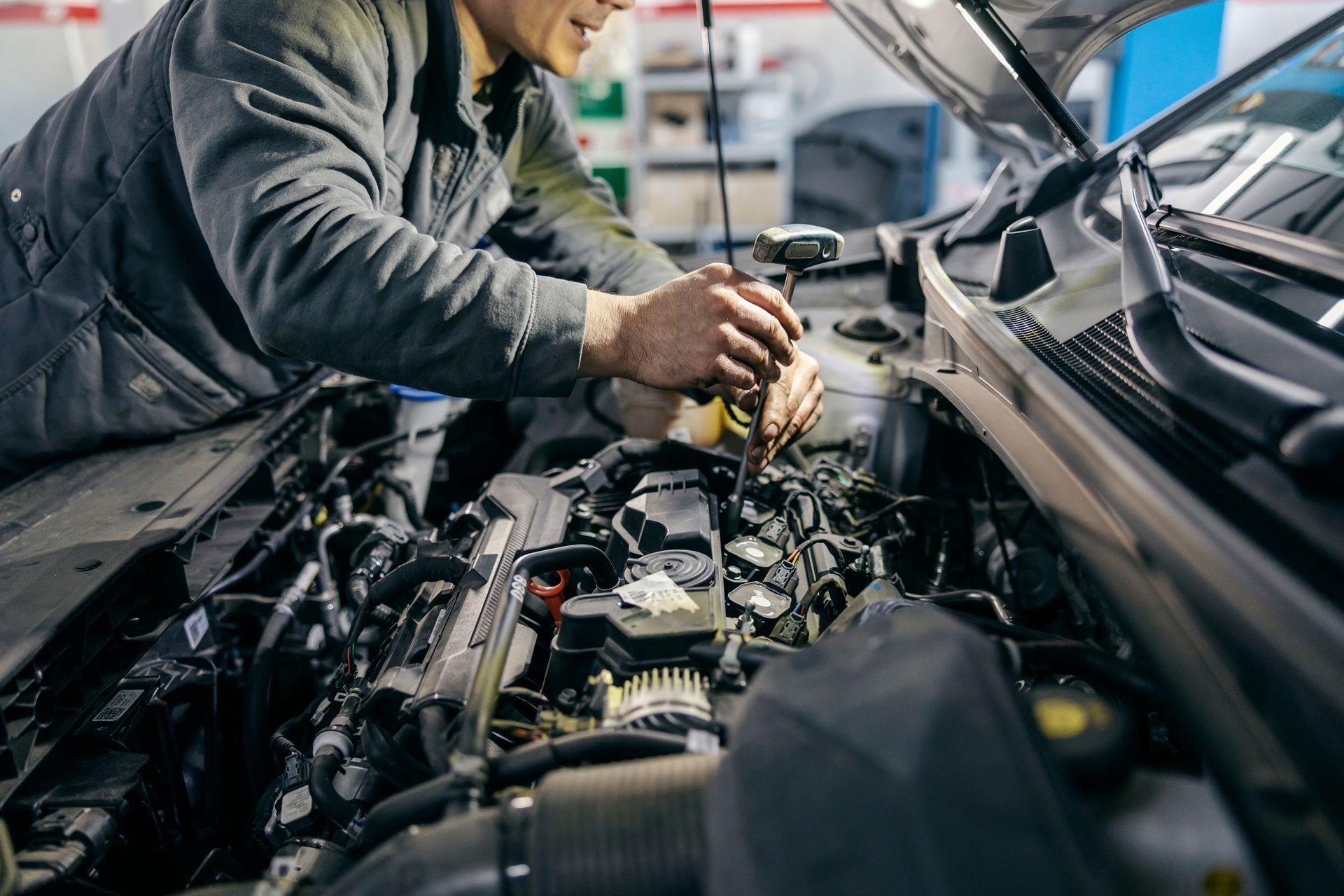 ASE Certified Mechanic Working On A Customer's Car Who Is From Clay Township.