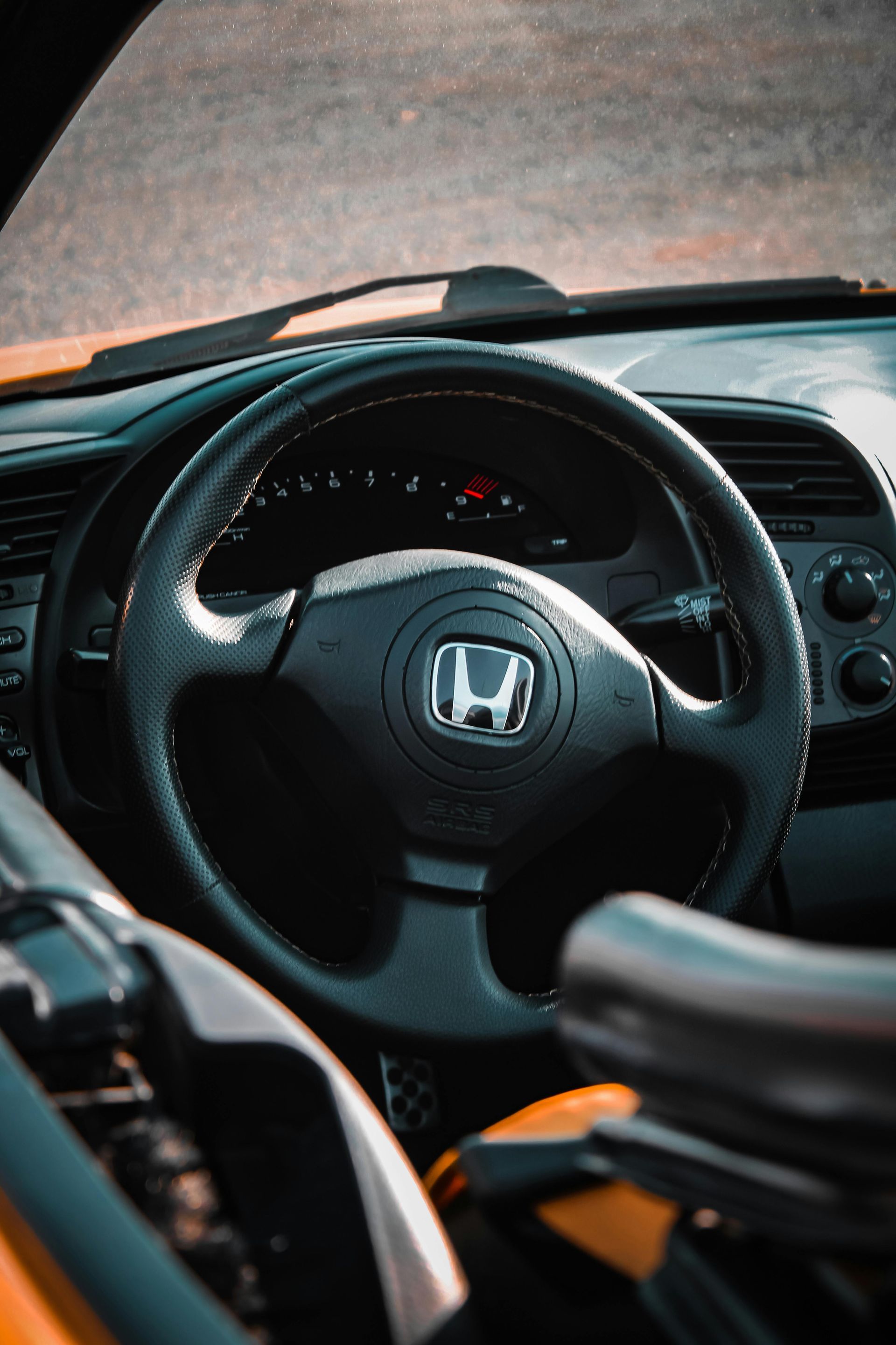 A close-up of a Honda steering wheel on a Honda vehicle from Macomb county.