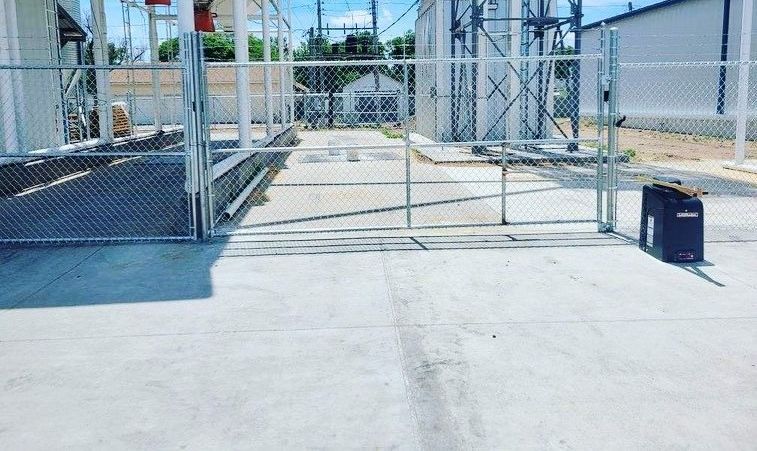 Commercial chain link security gate protecting an industrial property in Springfield, MO