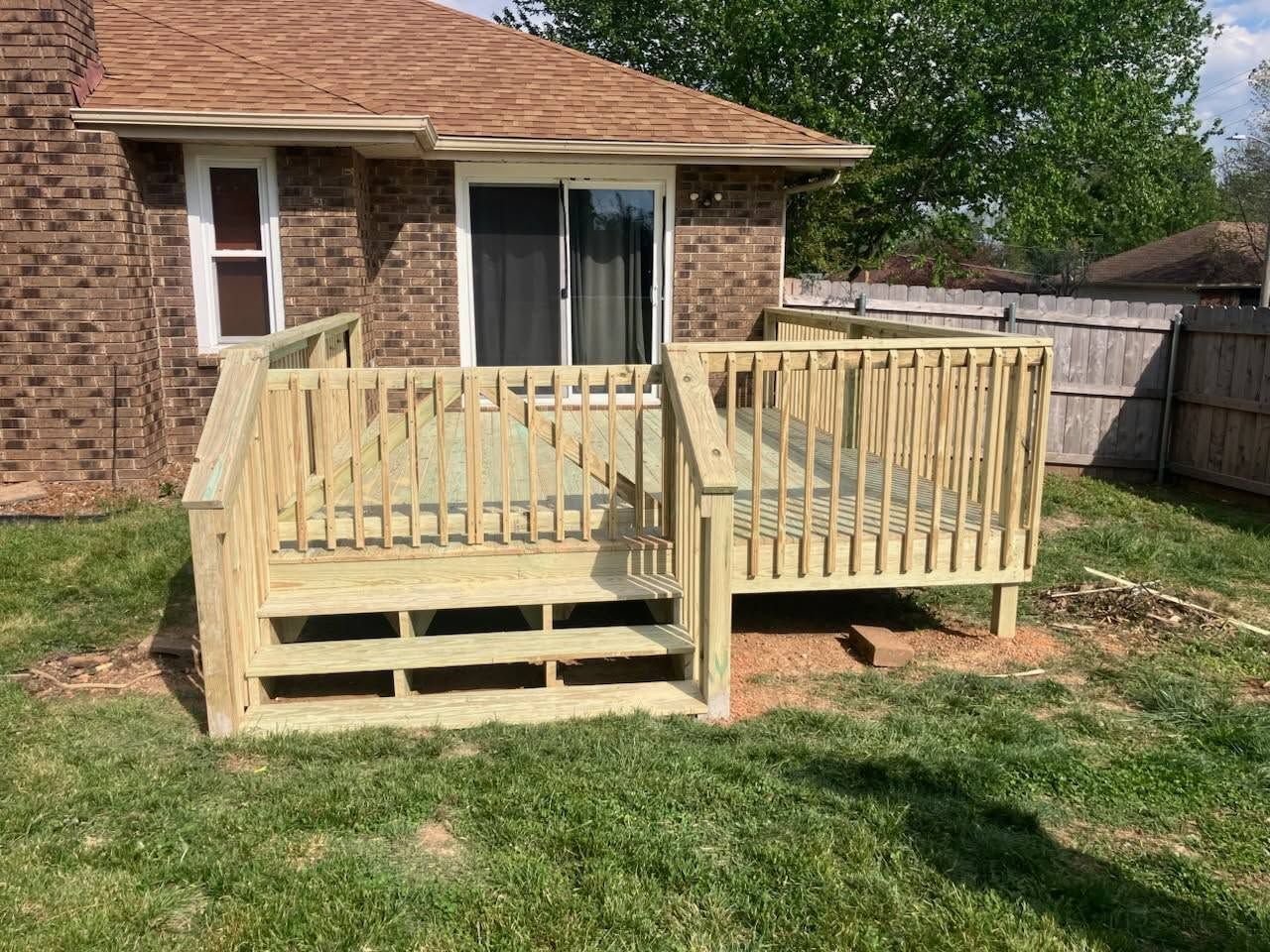 Wood privacy fence and gate installed at a Springfield, Missouri property