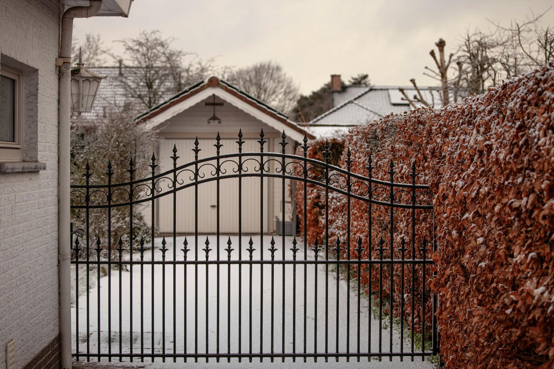 Residential fence surrounding a home and yard